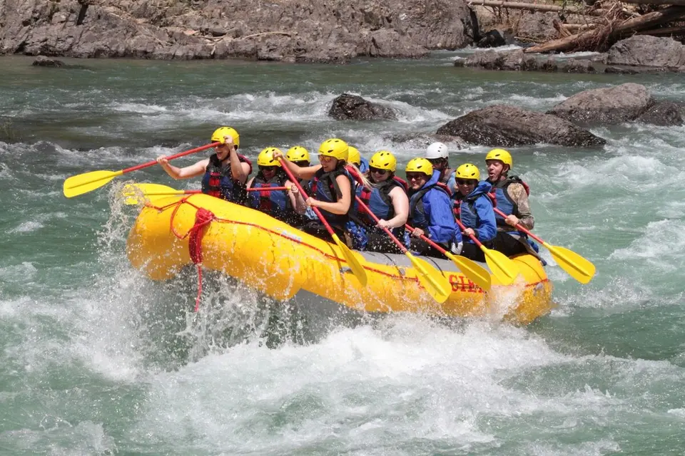The Oratio team rafting through white water rapids