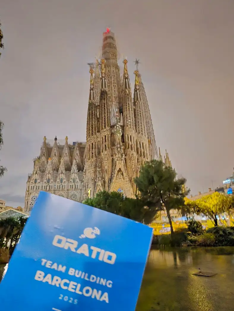 The Sagrada Família with an Oratio team-building sign in the foreground